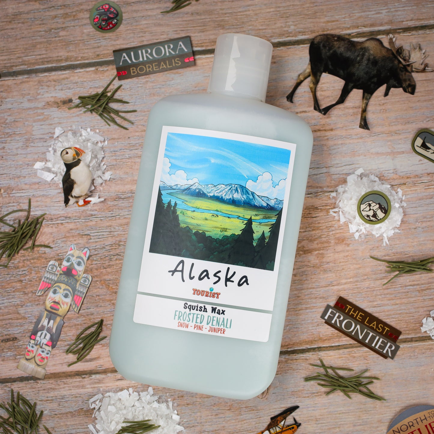Alaska Squish Wax in Frosted Denali scent, featuring snow, pine, and juniper notes with a scenic label.