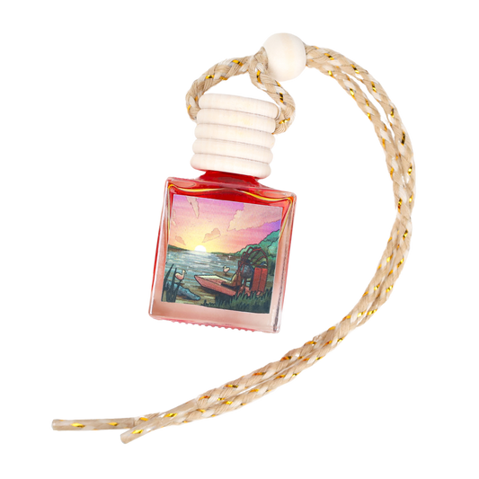Sunset-themed car air freshener in a pink glass bottle with a braided cord, perfect for a relaxing atmosphere.