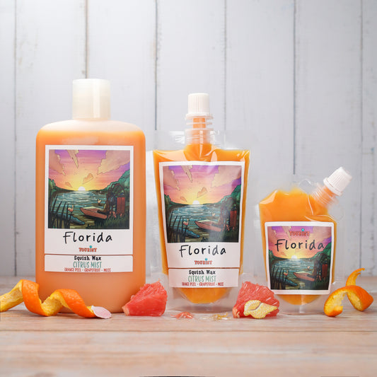 Florida Squish Wax Citrus Mist in orange, featuring orange peel and grapefruit scents, three sizes available.