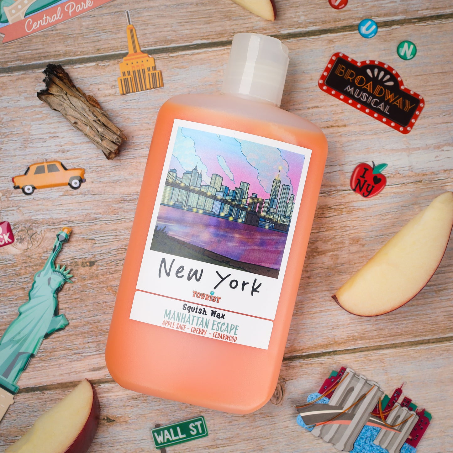 New York Squish Wax candle in peach color, featuring Manhattan Escape scent with apple, cherry, and cedarwood notes.