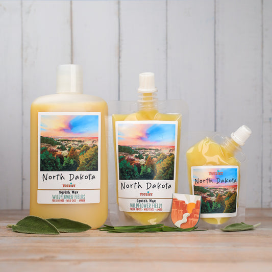 North Dakota Squish Wax in three sizes, Wildflower Fields scent, yellow color, with fresh grass and amber notes.