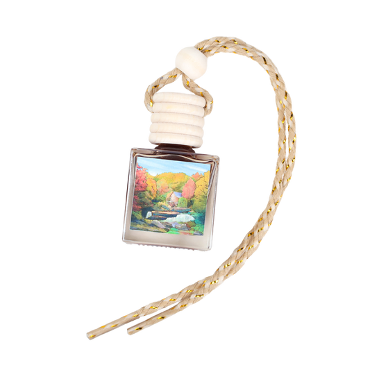 Elegant air freshener pendant with a scenic nature painting, featuring a braided rope and wooden cap.