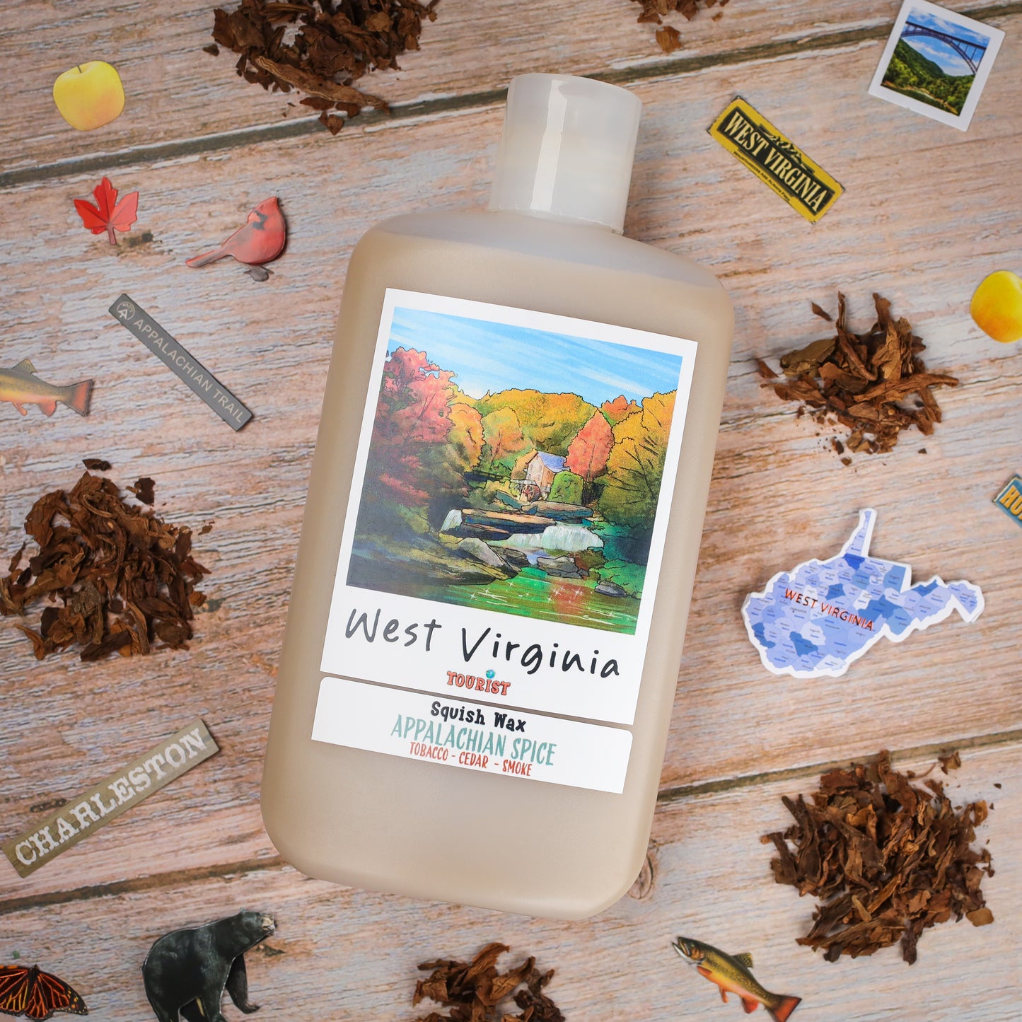 West Virginia Squish Wax in beige bottle, Appalachian Spice scent with tobacco, cedar, and smoke notes.