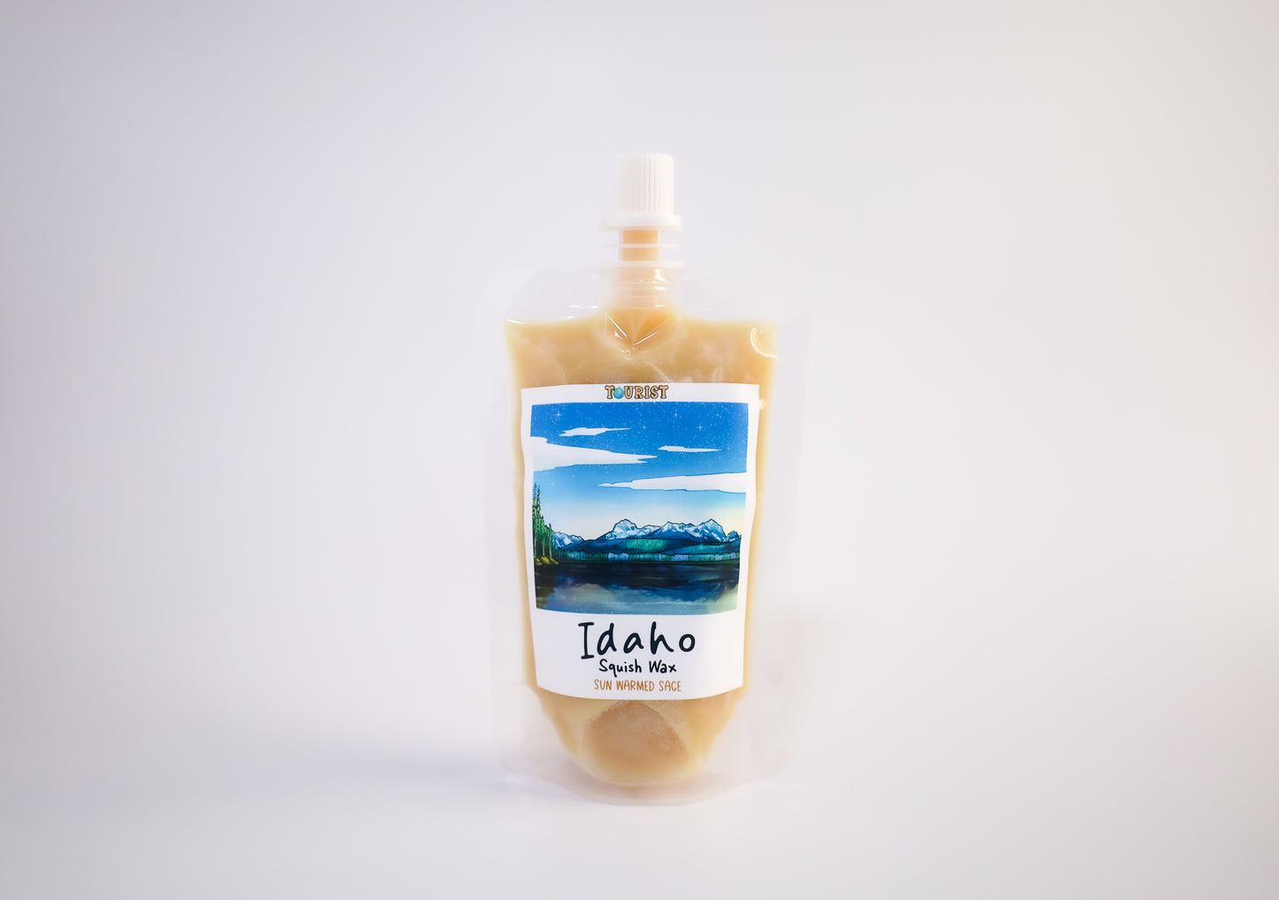 Squeeze pouch with a Idaho scenic label on a white background