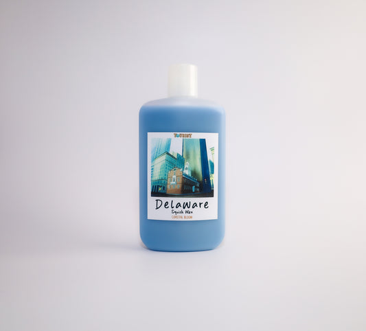 Squish wax bottle with a label on a white background