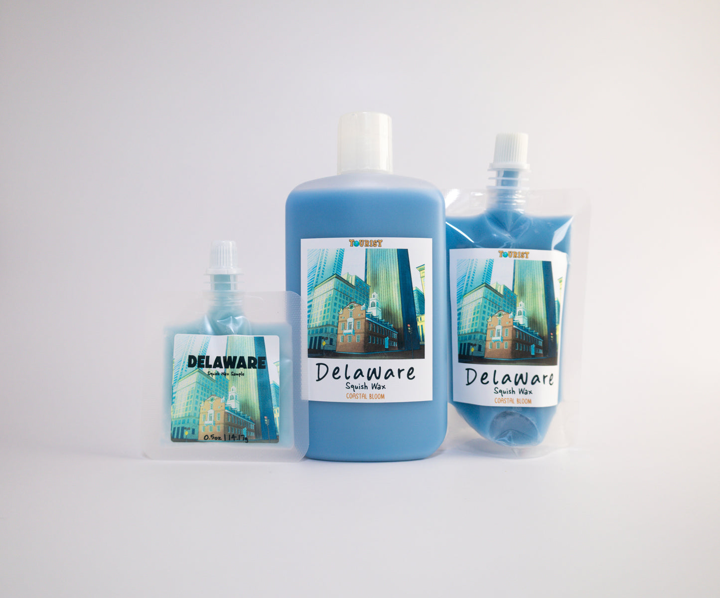 Three sizes of squish wax of Delaware scenic labels on a white background