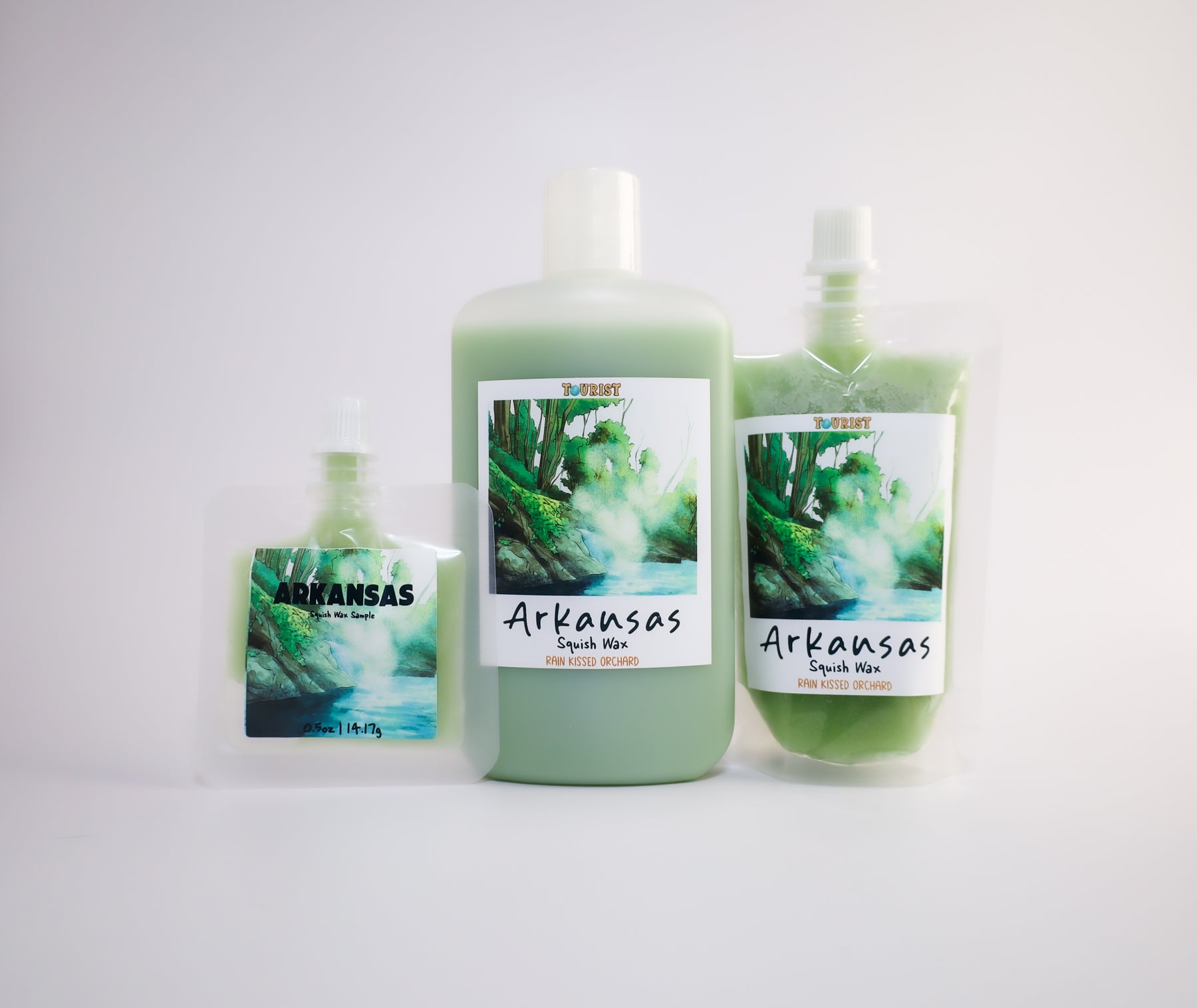 Three sizes of 'Arkansas' squish wax with a scenic design on a white background