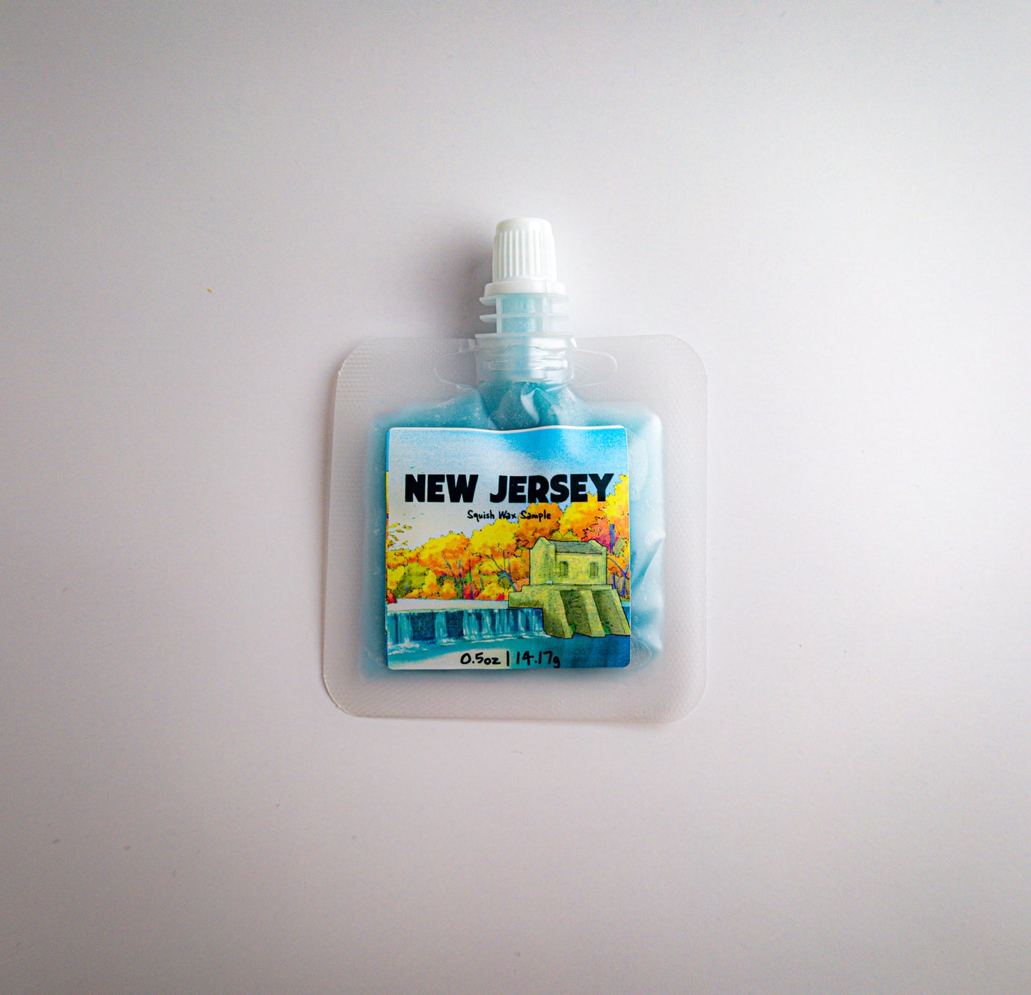 Small pouch with a scenic label of New Jersey on a light gray background
