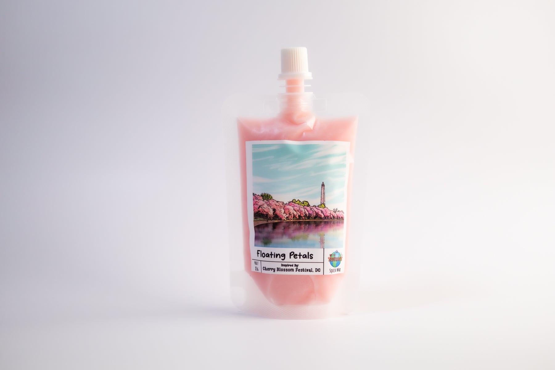 Pouch of cherry blossom-themed squeezable wax melt product with a scenic label on a white background