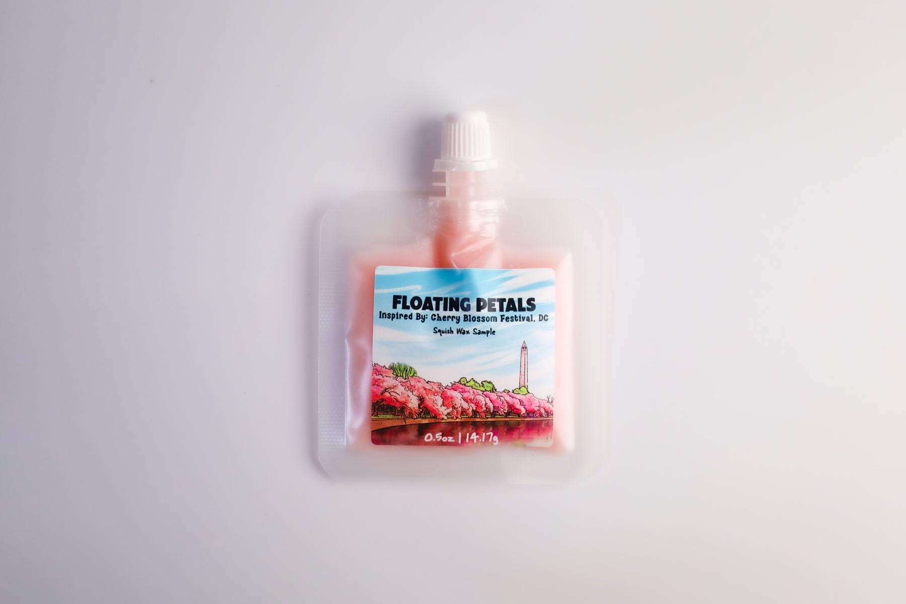 Squeezable wax melt packaged product with a label on a white background