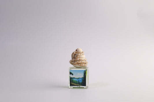 Small glass car freshener with Oregon themed artwork on white background