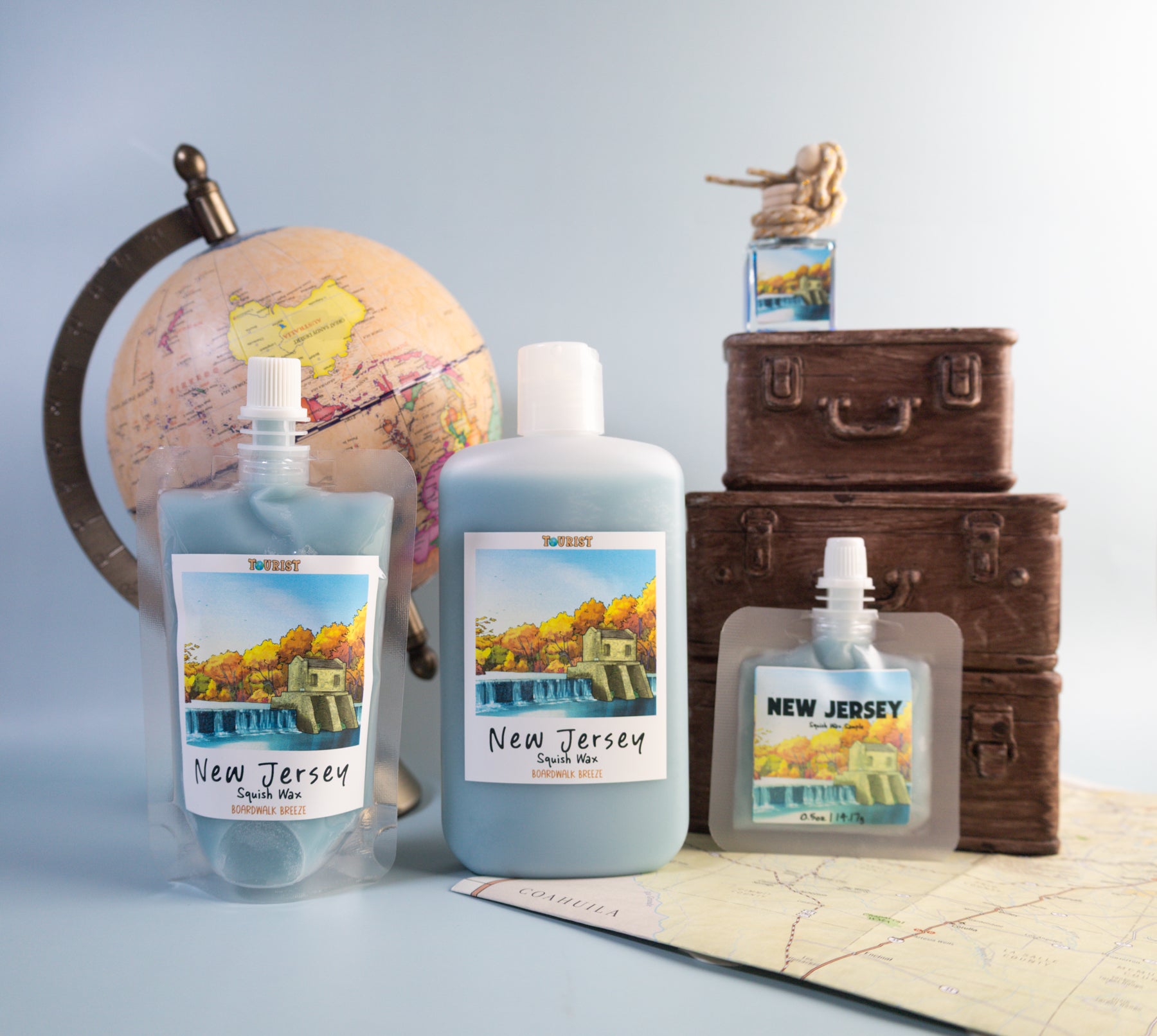 Different sizes of squish wax labeled 'New Jersey' with scenic labels on a map and globe background