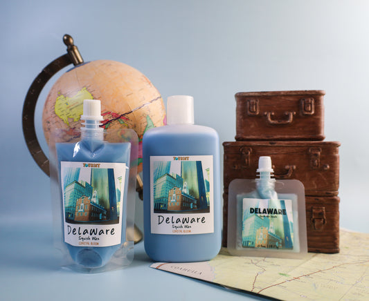 Three sizes of squish wax labeled 'Delaware' with a globe, suitcases, and map in the background.