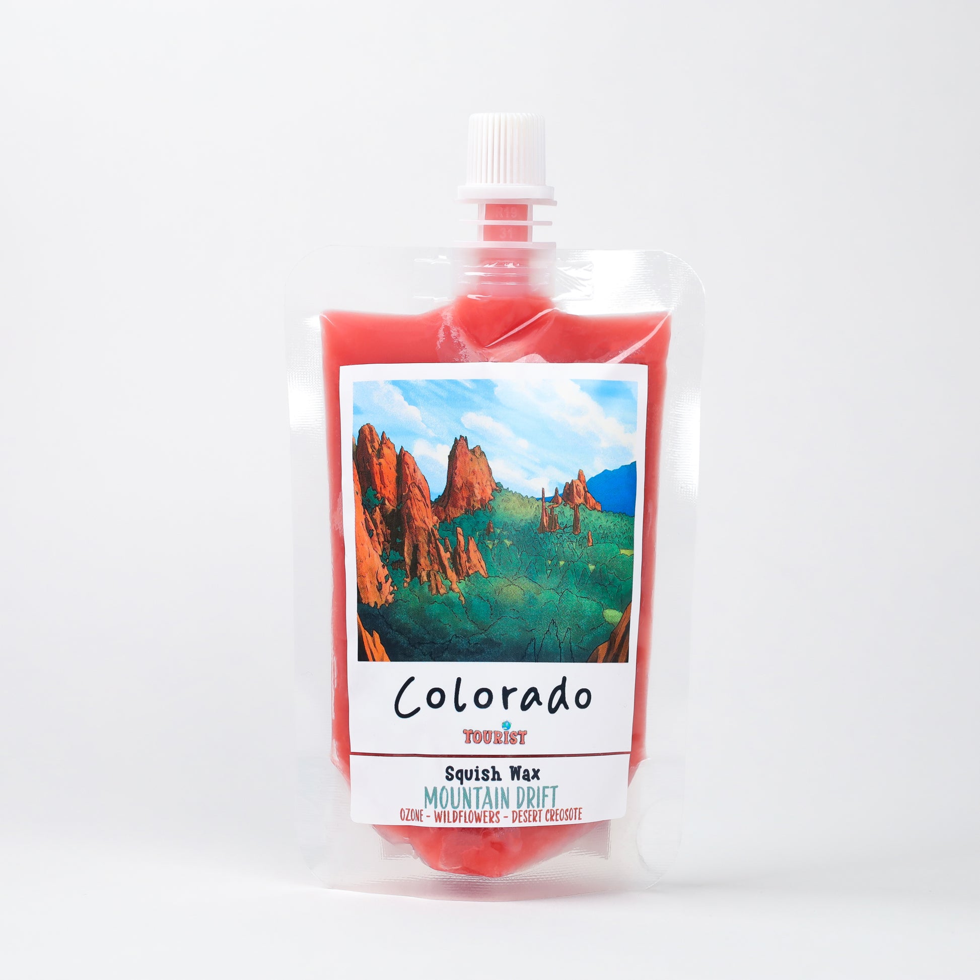 Colorado Squish Wax in vibrant red, featuring Mountain Drift scent with notes of ozone, wildflowers, and desert.