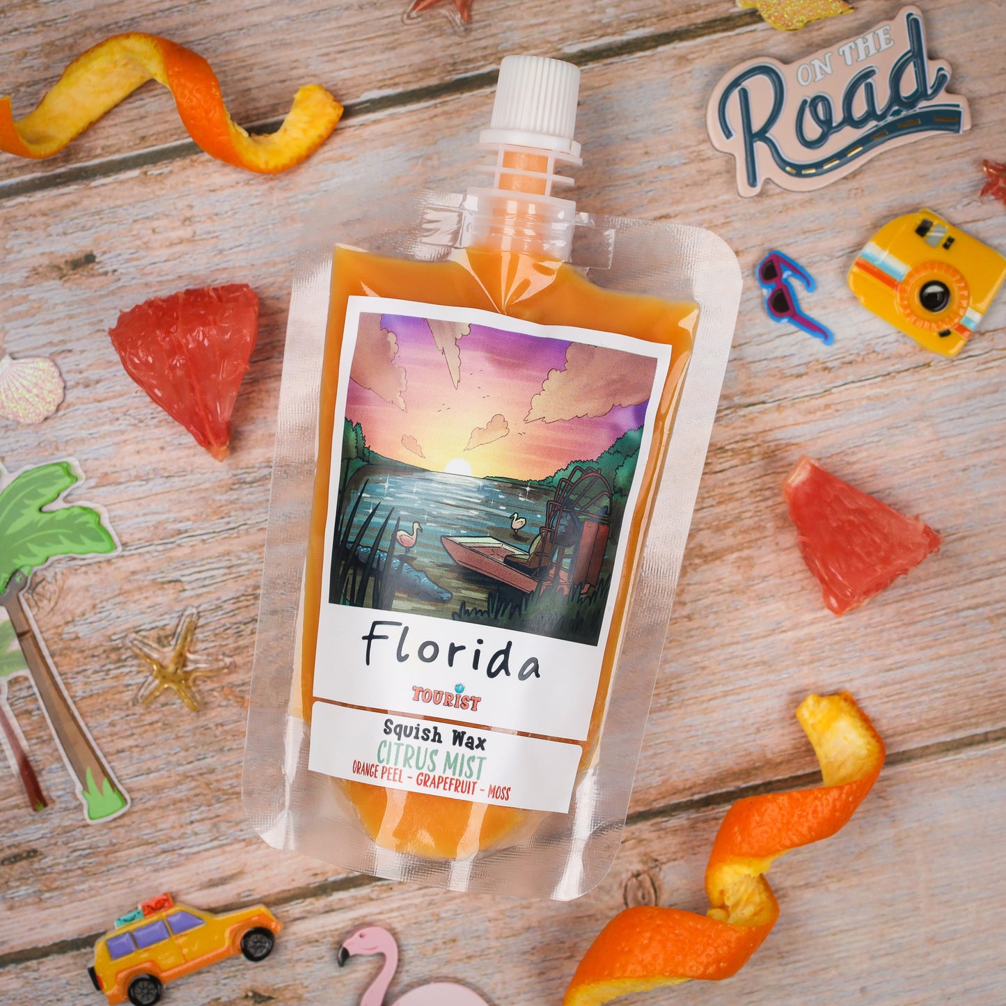 Florida Squish Wax in Citrus Mist scent, featuring orange peel and grapefruit, packaged in a vibrant pouch.