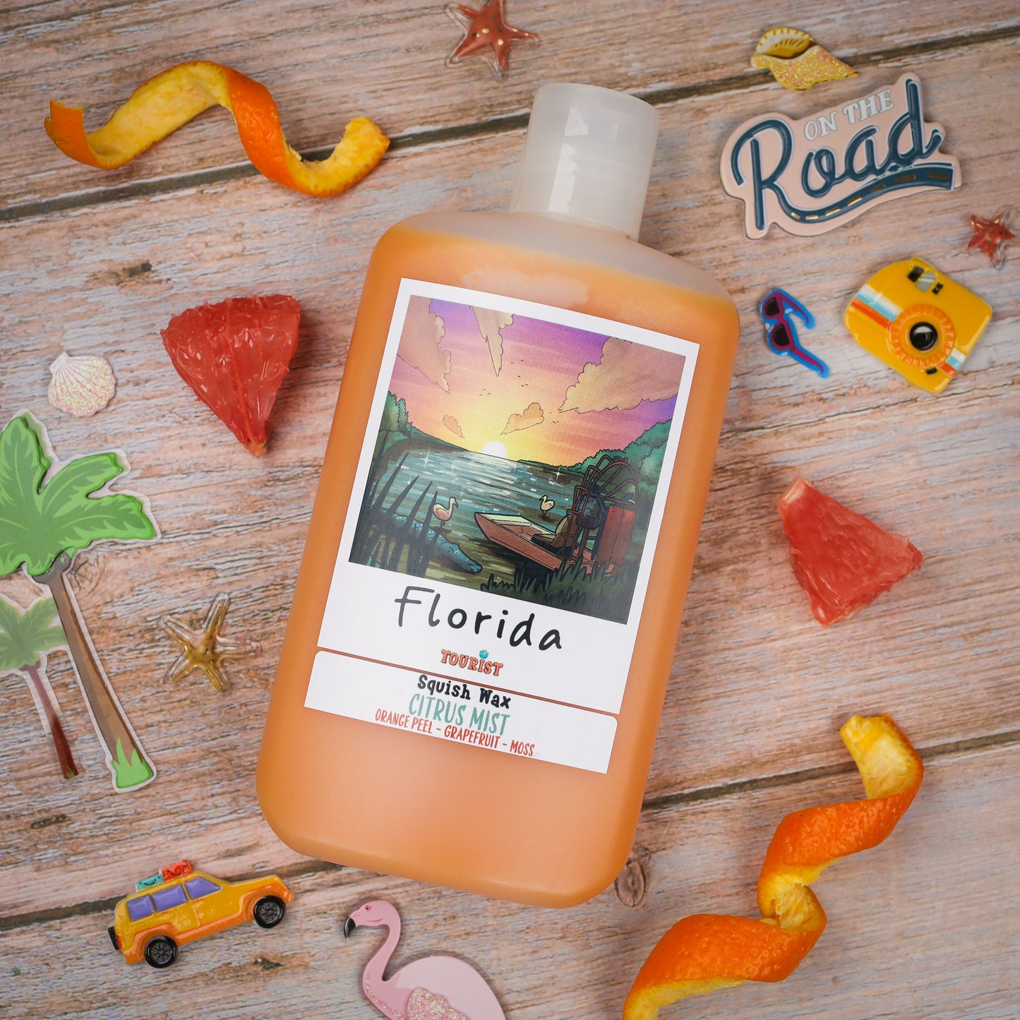 Florida Squish Wax in Citrus Mist scent, orange gel with notes of orange peel and grapefruit.