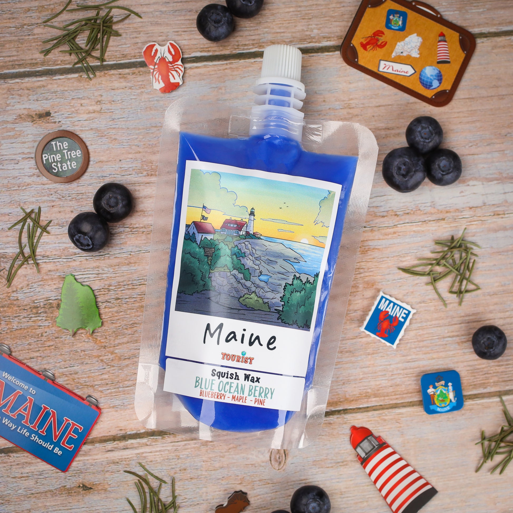 Maine Squish Wax in Blue Ocean Berry scent, featuring blueberry, maple, and pine notes, packaged in a colorful pouch.