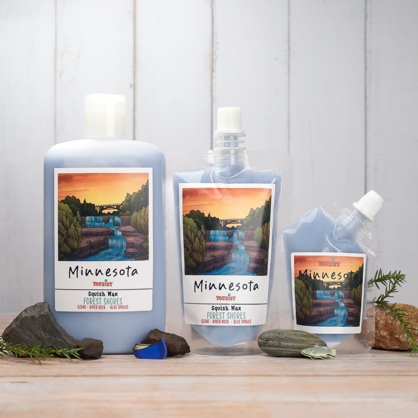 Minnesota Squish Wax in blue, featuring Forest Shores scent with ozonic notes, displayed in three sizes.