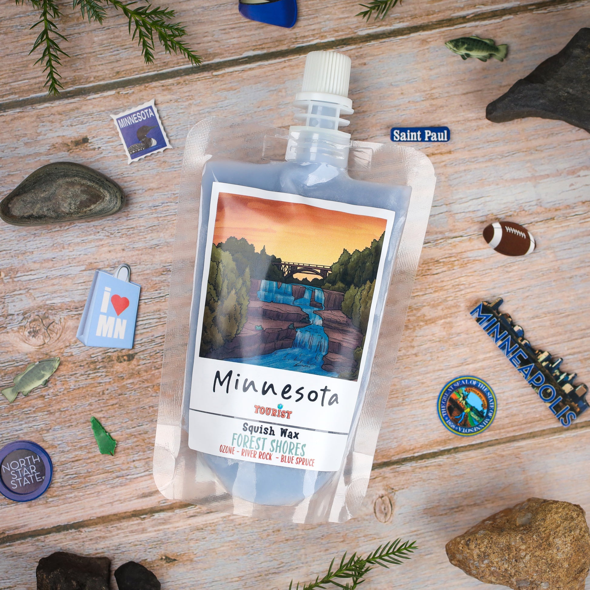 Minnesota Squish Wax, 'Forest Shores' scent in a compact pouch, features ozone, river rock, and blue spruce notes.