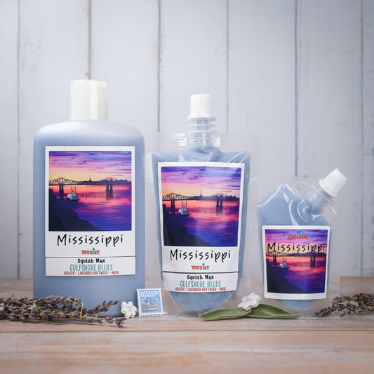 Three bottles of Mississippi Squish Wax in Gulfshore Blues, featuring aquatic lavender driftwood scent.