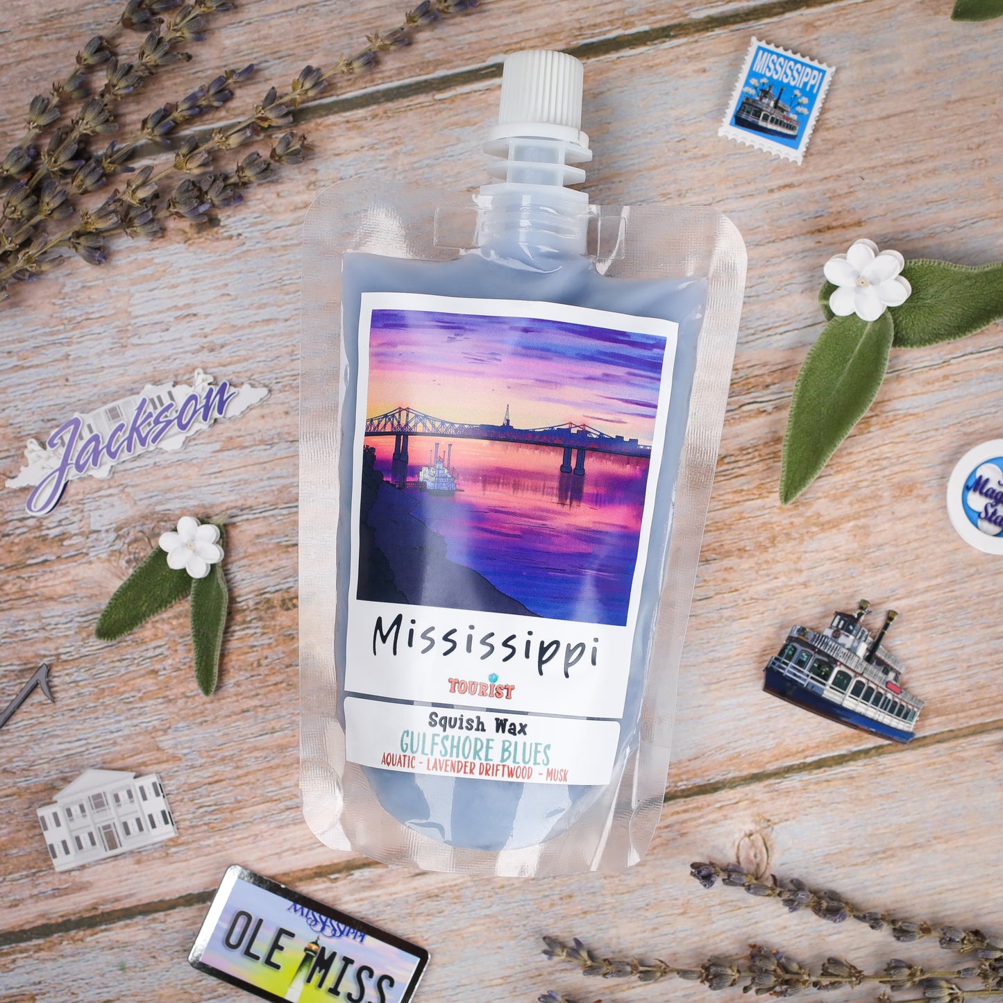 Squish Wax Gulfshore Blues candle in blue pouch, featuring aquatic, lavender, and driftwood scents.