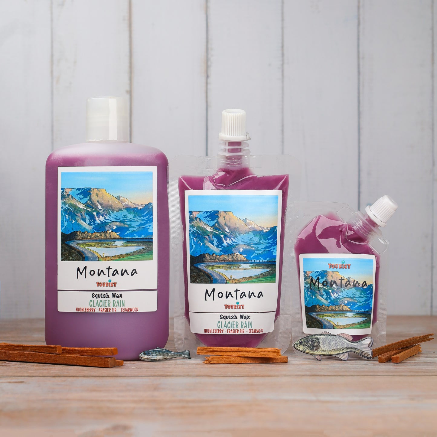 Montana Tourist Squish Wax in Glacier Rain scent, purple, huckleberry, fir, cedarwood, three sizes.
