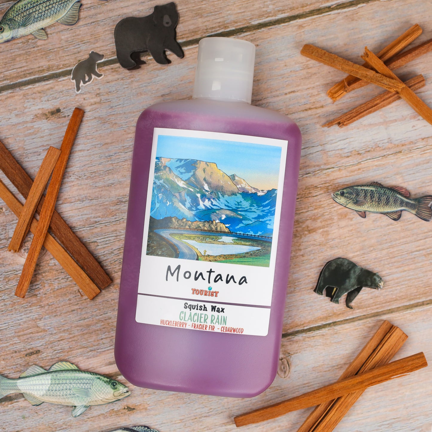 Montana Squish Wax in Glacier Rain scent, purple bottle with huckleberry, fir, and cedarwood notes.
