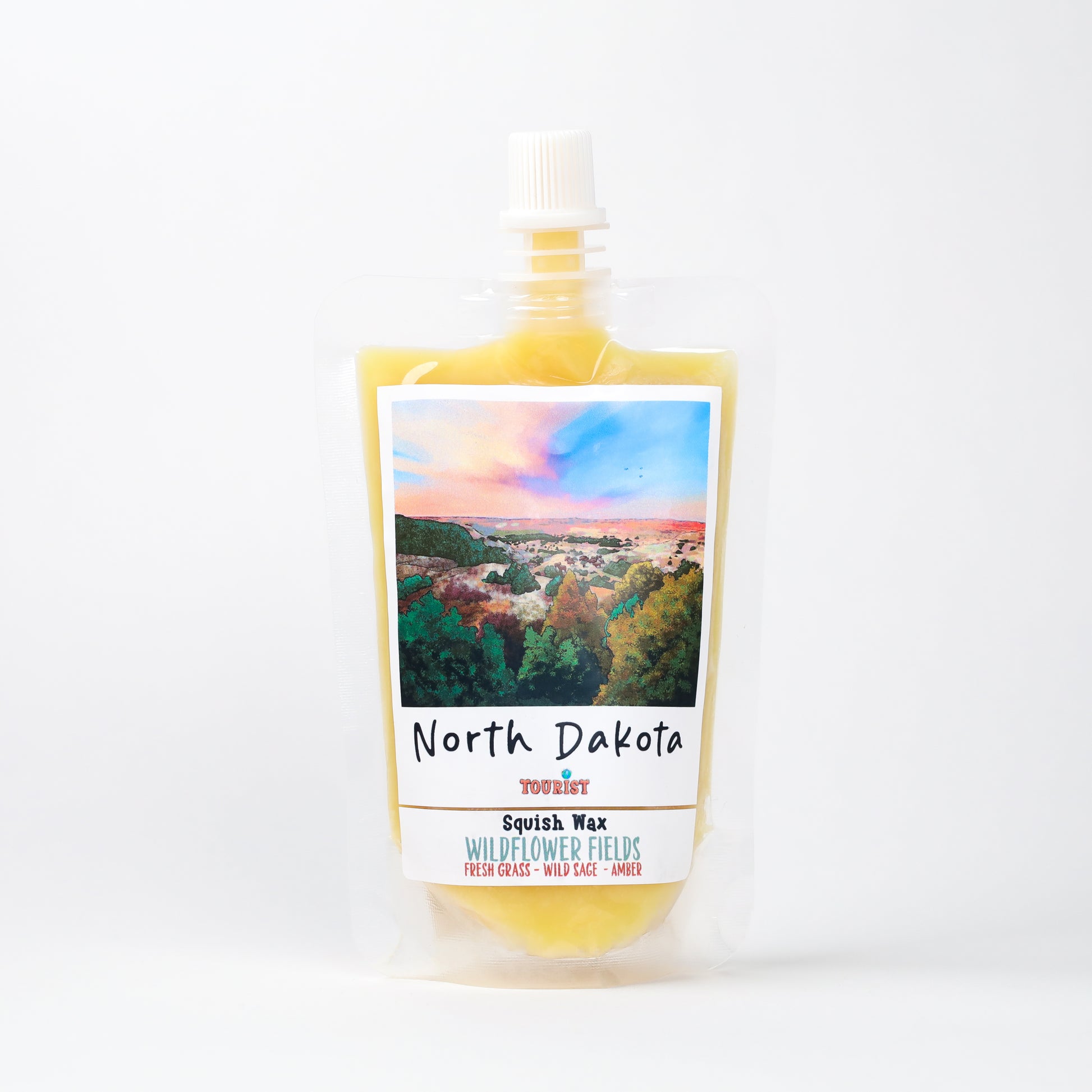 North Dakota Squish Wax in Wildflower Fields scent, features fresh grass, wild sage, and amber aromas.