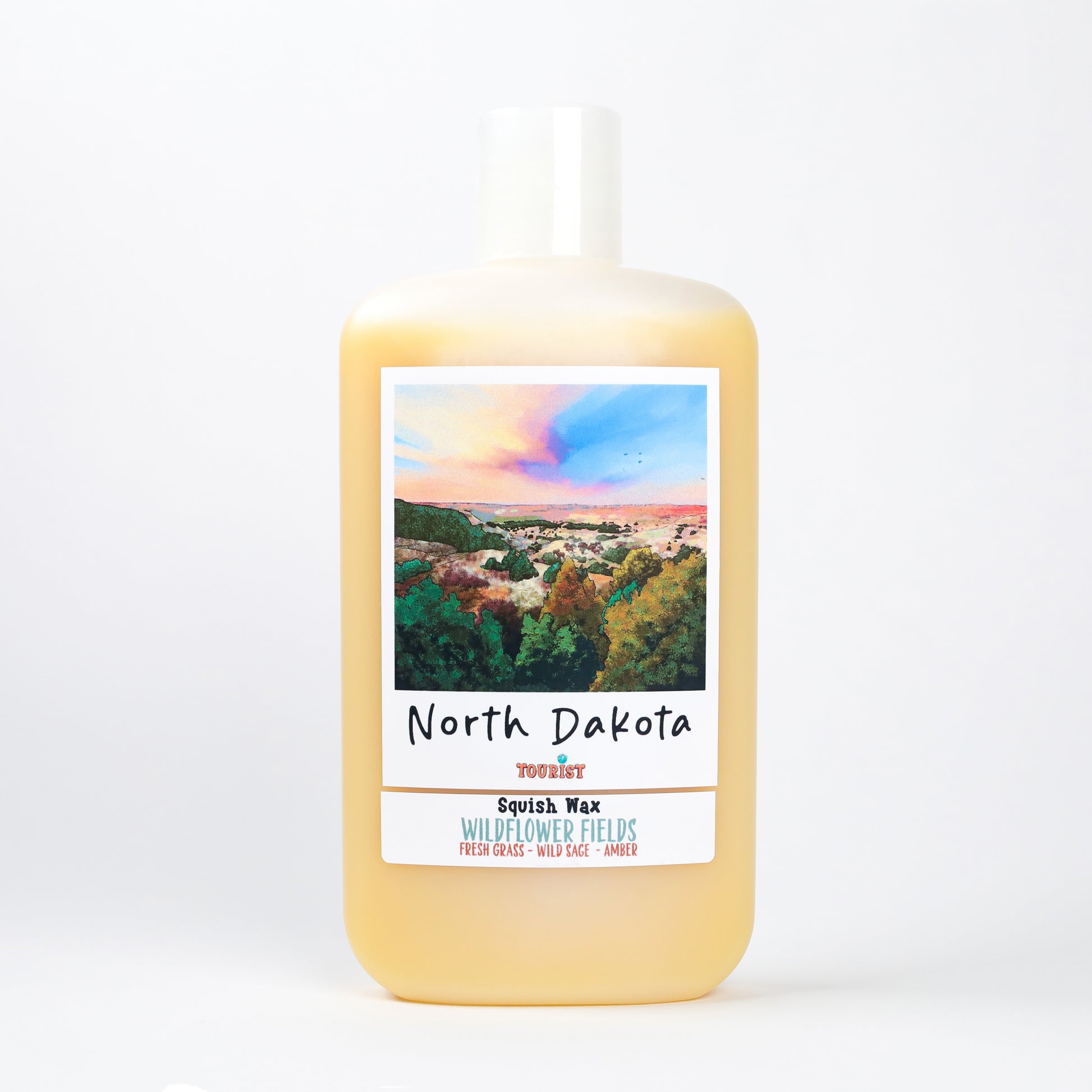 North Dakota Squish Wax in amber color, featuring Wildflower Fields scent with fresh grass and wild sage.