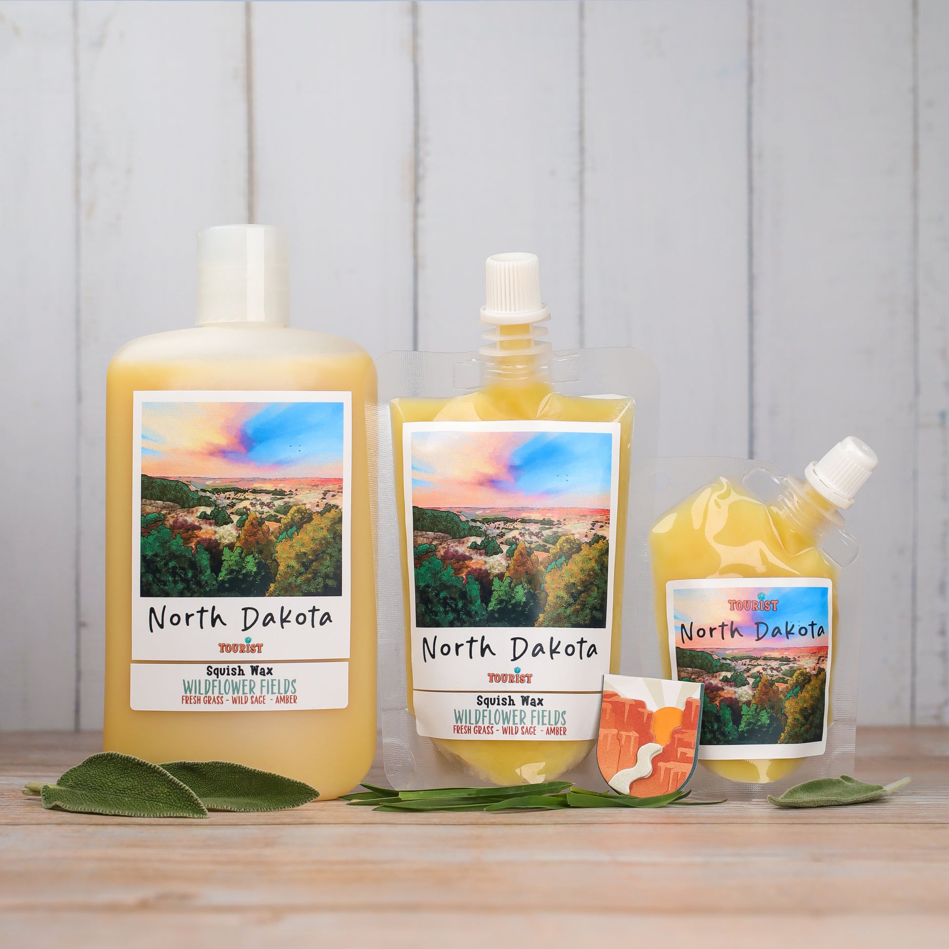 North Dakota Squish Wax in three sizes, Wildflower Fields scent, yellow color, with fresh grass and amber notes.