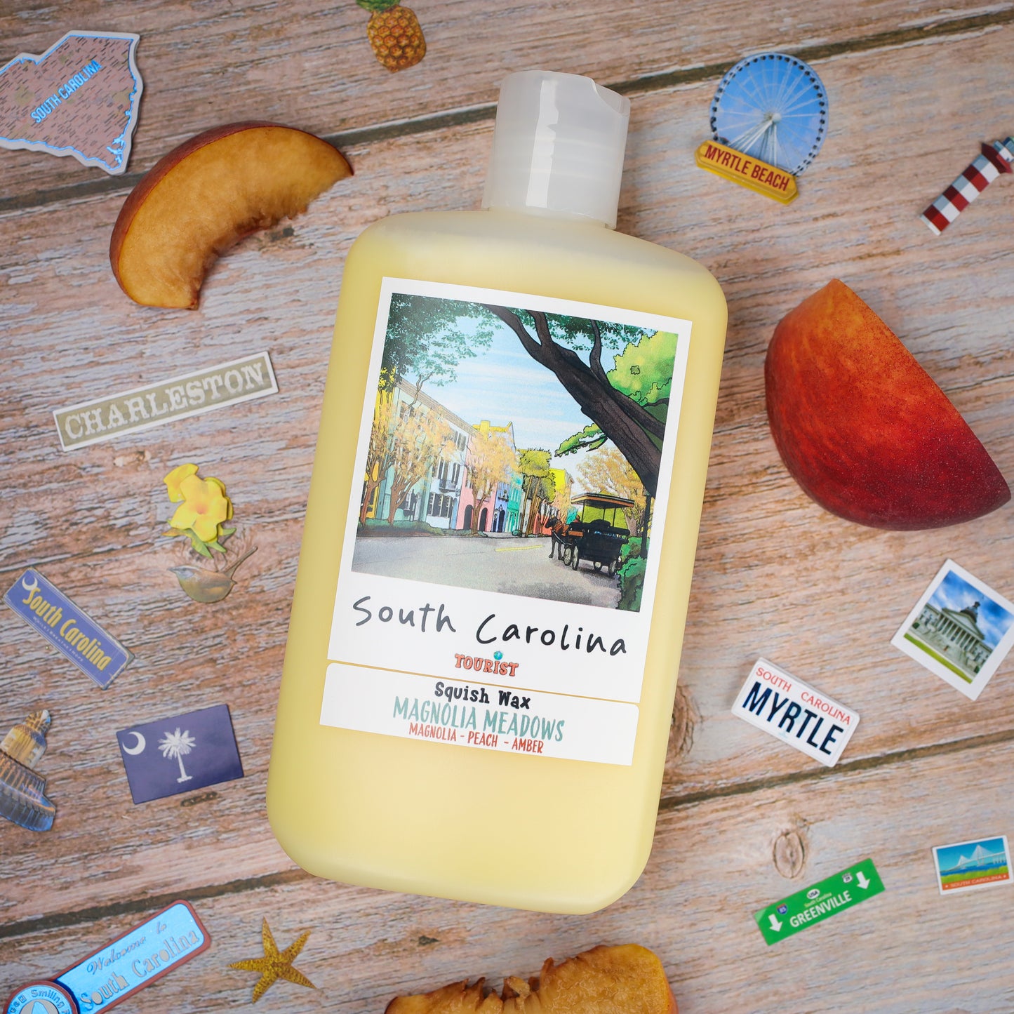 South Carolina Squish Wax candle in yellow, featuring magnolia, peach, and amber scents, with artistic label.