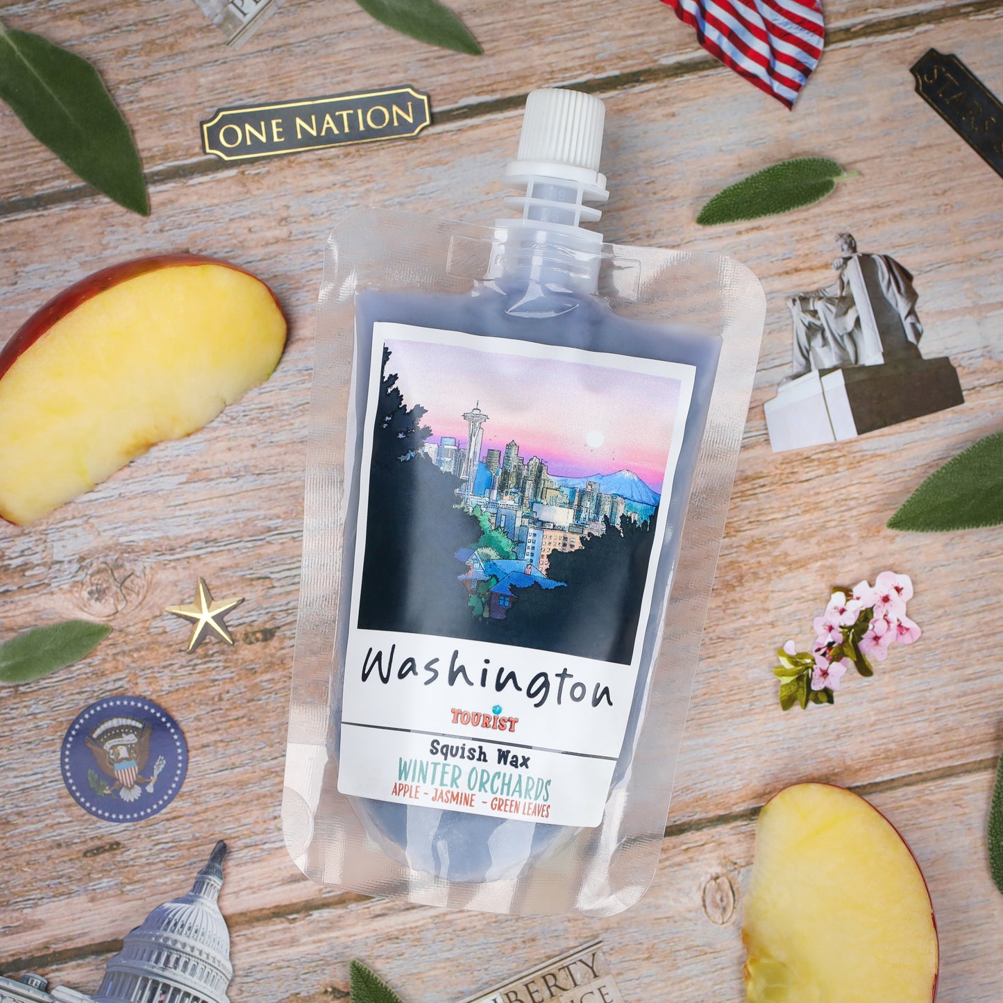 Washington Squish Wax - Winter Orchards scent, featuring apple, jasmine, and green leaves, in a resealable pouch.