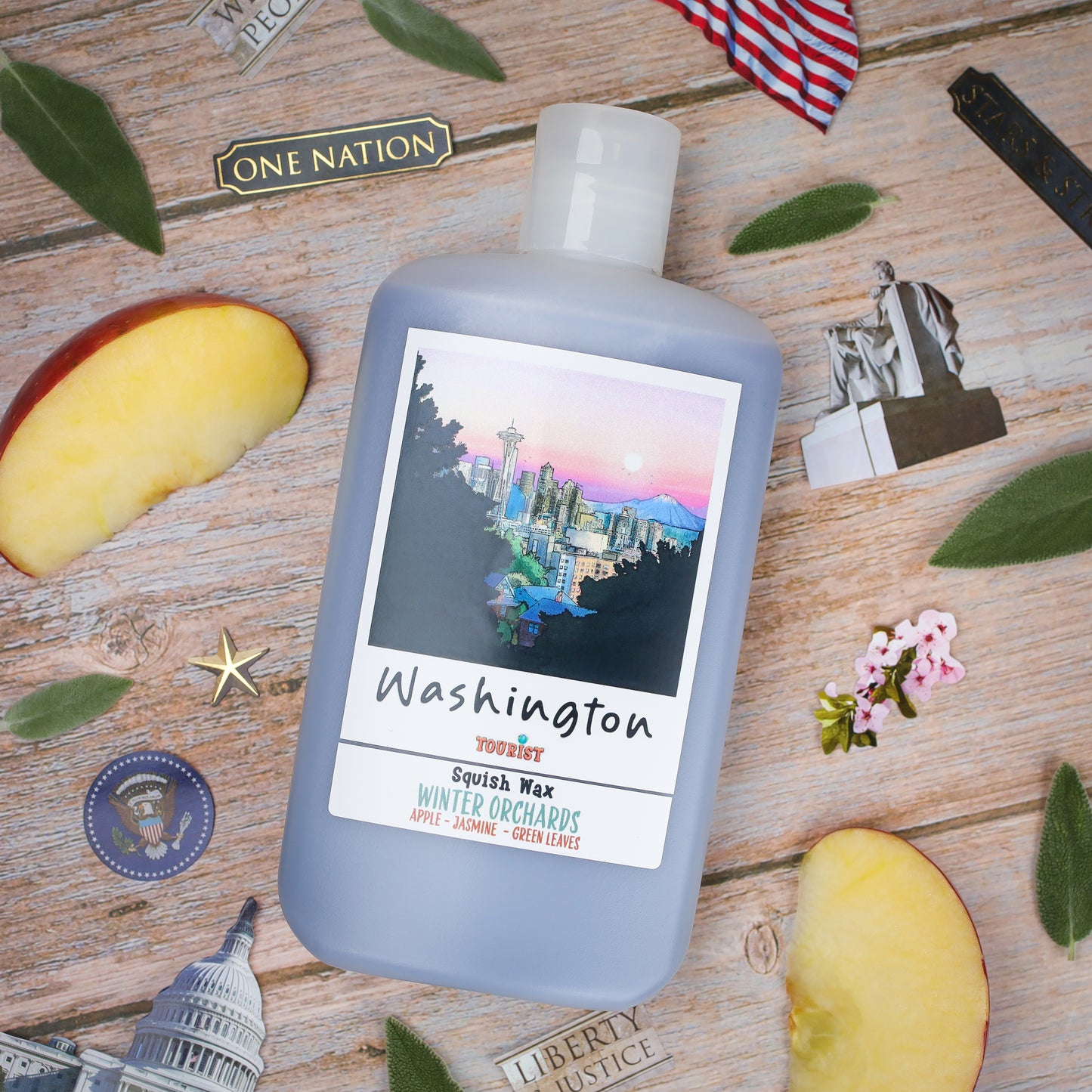 Squish Wax in gray bottle, 'Washington' scent, featuring apple, jasmine, and green leaves fragrances.